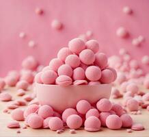 ai gegenereerd roze snoepjes in een kom Aan een roze achtergrond. selectief focus. foto