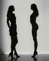 ai gegenereerd silhouet van drie Dames in zwart en wit jurken, studio schot. ai generatief foto