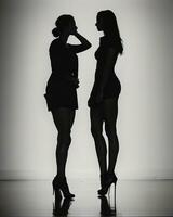 ai gegenereerd silhouet van drie Dames in zwart en wit jurken, studio schot. ai generatief foto