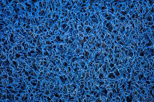 blauw vinyl krullen tapijt of verdieping mat achtergrond foto