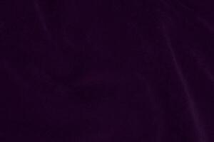 donker Purper fluweel kleding stof structuur gebruikt net zo achtergrond. paars kleur Purper kleding stof achtergrond van zacht en glad textiel materiaal. verpletterd fluweel .luxe donker toon voor zijde. foto