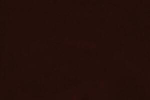 donker rood fluweel kleding stof structuur gebruikt net zo achtergrond. zijde kleur scharlaken kleding stof achtergrond van zacht en glad textiel materiaal. verpletterd fluweel .luxe donker toon voor zijde. foto