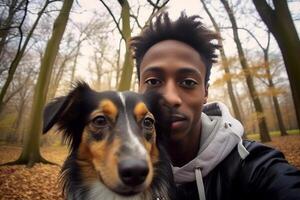 ai generatief jong gelukkig Mens nemen selfie met zijn hond in een park glimlachen vent en puppy hebben pret samen buitenshuis vriendschap en liefde tussen mensen en dieren concept foto