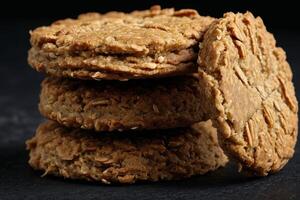 ai gegenereerd anzac biscuit Aan zwart achtergrond foto