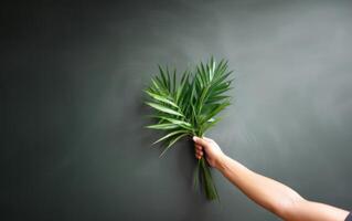 ai gegenereerd hand- Holding palm blad met kopiëren ruimte. palm zondag viering. generatief ai foto