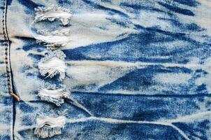 rimpels blauw jeans textuur. jeans achtergrond. foto