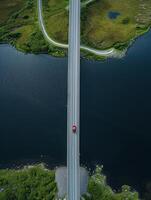 ai gegenereerd antenne visie vangt lang brug dat strekt zich uit aan de overkant donker blauw lichaam van water ai gegenereerd foto