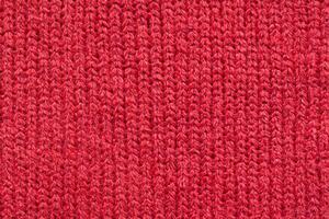 rood gebreid wol kleding stof structuur achtergrond foto