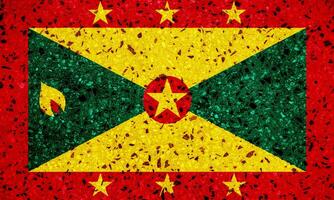 vlag van Grenada Aan een getextureerde achtergrond. concept collage. foto