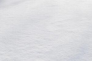 wit schoon glimmend sneeuw achtergrond textuur. vers sneeuw naadloos textuur. besneeuwd oppervlakte detailopname foto