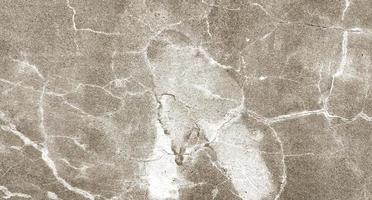 grijze gebarsten cement textuur voor achtergrond. muur krassen foto