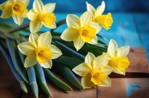 ai gegenereerd moeders dag, Internationale vrouwen dag, st. davids dag, voorjaar bloemen, boeket van geel narcissen, blauw achtergrond, houten tafel foto