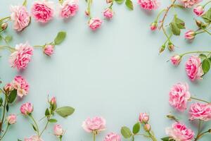 ai gegenereerd een karton kader van roze bloemen Aan een licht blauw achtergrond foto