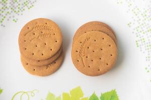 heerlijk Aziatisch koekjes koekjes. deze spijsvertering genre biscuit is hoog in dieet vezel en heeft goedheid van geheel maaltijd meel, droog melk. halfzoet knapperig biscuit is een voedingswaarde ponsen. foto