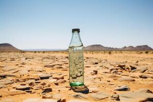 ai gegenereerd glas fles van water in de midden- van de woestijn. klimaat verandering concept. generatief ai foto