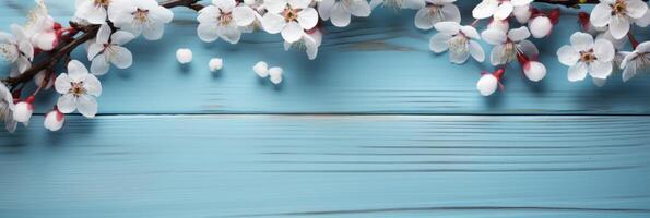 ai gegenereerd kers bloesem Aan een blauw houten tafel achtergrond. foto