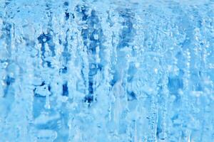 wazig achtergrond - ijs of water stroom met bubbels foto