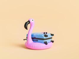 flamingo vlotter en koffer met zonnebril, vakantie concept foto
