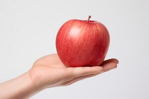 ai gegenereerd een persoon Holding een rood appel in hun hand- foto