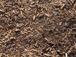 boom chips, hakselhout en steentjes Aan de grond texturen foto