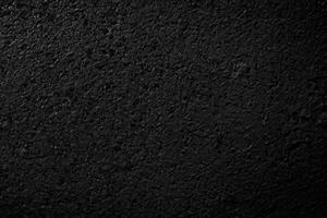 zwart asfalt textuur. asfalt weg. steen asfalt structuur achtergrond zwart graniet grind foto