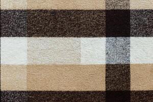 bruin geruit wol plaid kleding stof textuur. Schotse ruit structuur foto