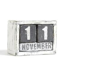 november 11 Aan houten kalender, Aan wit achtergrond. foto