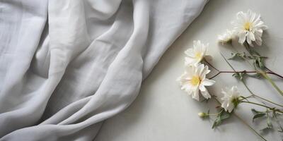 ai gegenereerd boeket van vers bloemen Aan wit linnen kleding stof. natuurlijk textiel met bloem samenstelling. generatief ai foto