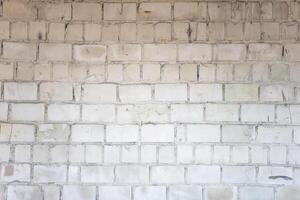 steen muur. structuur van oud wit bakstenen. foto