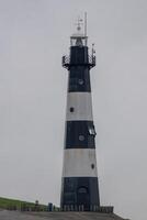 vuurtoren en strand Aan de westerschelde in Breskens, Zeeland, de Nederland foto