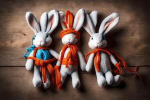 ai gegenereerd drie gevuld konijnen met oranje en blauw banden foto