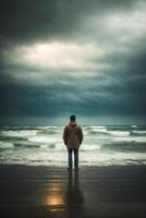 ai gegenereerd een eenzaam depressief Mens staat Aan een strand in de regenen, op zoek uit Bij de oceaan foto