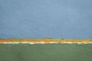 abstract landschap in pastel tonen met een blauw lucht - een verzameling van handgemaakt vod papieren foto