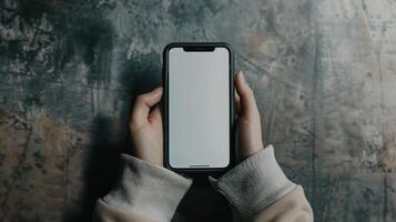 ai gegenereerd een top visie van een hand- gebruik makend van een telefoon met een wit scherm, perfect voor presentatie van mobiel app ontwerpen of digitaal inhoud. ai gegenereerd foto