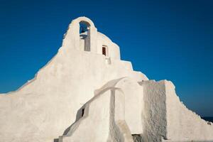 Grieks orthodox kerk van panagia paraportiani in stad- van koor Aan Mykonos eiland foto