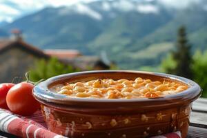 ai gegenereerd hartelijk Asturisch fabada in traditioneel keramisch schotel met majestueus berg visie foto