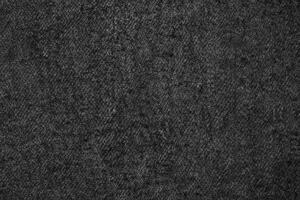 knus gebreid wol textuur, natuurlijk zwart met donker grijs geweven katoen canvas achtergrond. foto