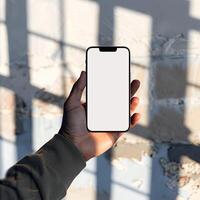 ai gegenereerd modern smartphone model. hand- Holding smartphone met wit blanco scherm. foto
