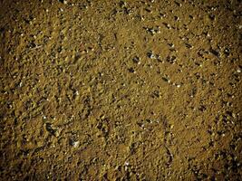 textuur van donker zand aan zee foto