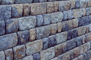 muur detail meerdere lagen van blauw en rood stenen foto