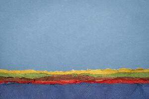 abstract landschap met een blauw lucht en oceaan of zee - een verzameling van handgemaakt getextureerde kunst papieren foto