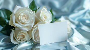 ai gegenereerd een boeket van groot en mooi wit rozen met een leeg wit kaart voor schrijven geplaatst in voorkant van de bloemen Aan schijnend lichtblauw zijde kleding stof. gegenereerd door kunstmatig intelligentie. foto