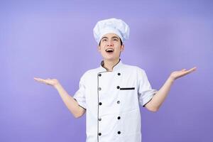 jong Aziatisch mannetje chef Aan achtergrond foto