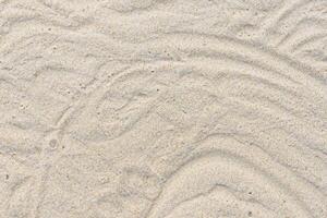 zand van kalmte omarmen de schoonheid van natuurlijk motief zand, een rustig tapijtwerk van van de aarde patronen foto