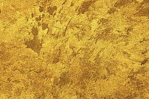 structuur van gouden decoratief gips of concreet. abstract goud grunge achtergrond. foto