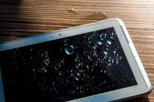 er is water op de tablet gemorst foto