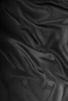zwart getextureerde kleding stof, elegant achtergrond. foto