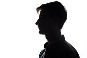 ai gegenereerd silhouet van jong Mens portret in overhemd met hand- Aan studio geïsoleerd wit achtergrond. dichtbij omhoog. foto