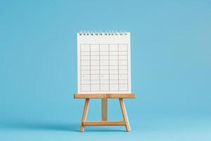 ai gegenereerd houten kalender Aan blauw achtergrond voor Internationale picknick en paniek dag. foto