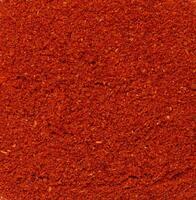 structuur van gerookt grond rood paprika, vol kader foto